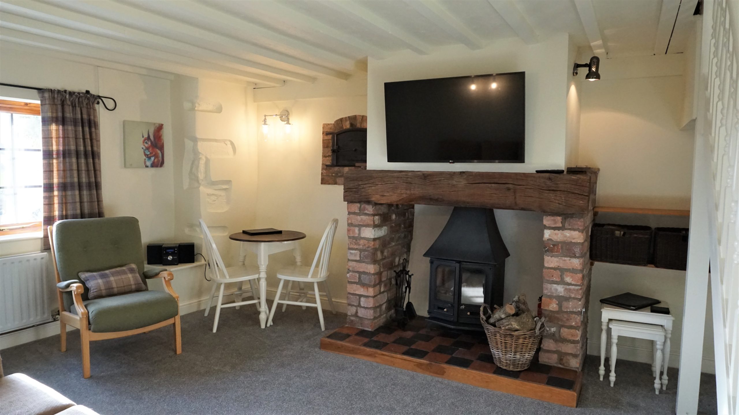 With a cosy log burner. Barley cottage offers the ideal couples hot tub holiday